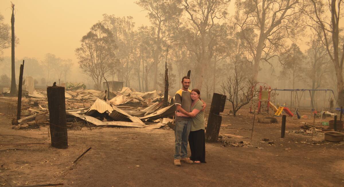 Jamie Zaia and Anita Reeves are "devastated" after losing their home in the bushfire which ripped through west Willawarrin last Friday afternoon. Photo: Callum McGregor