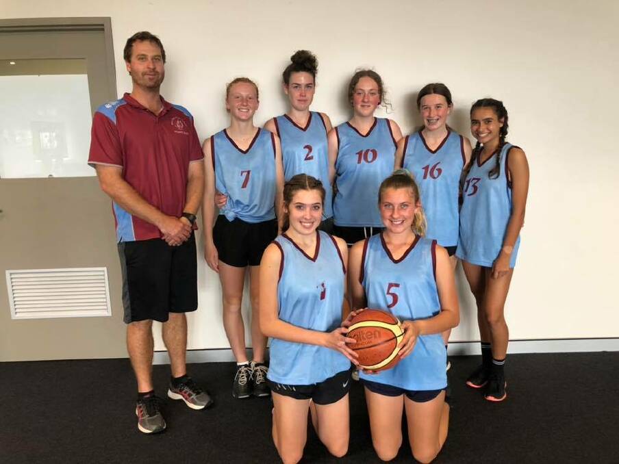Increasing involvement: Melville High School teacher David Jacobs with the school's basketball team. Photo: Supplied.
