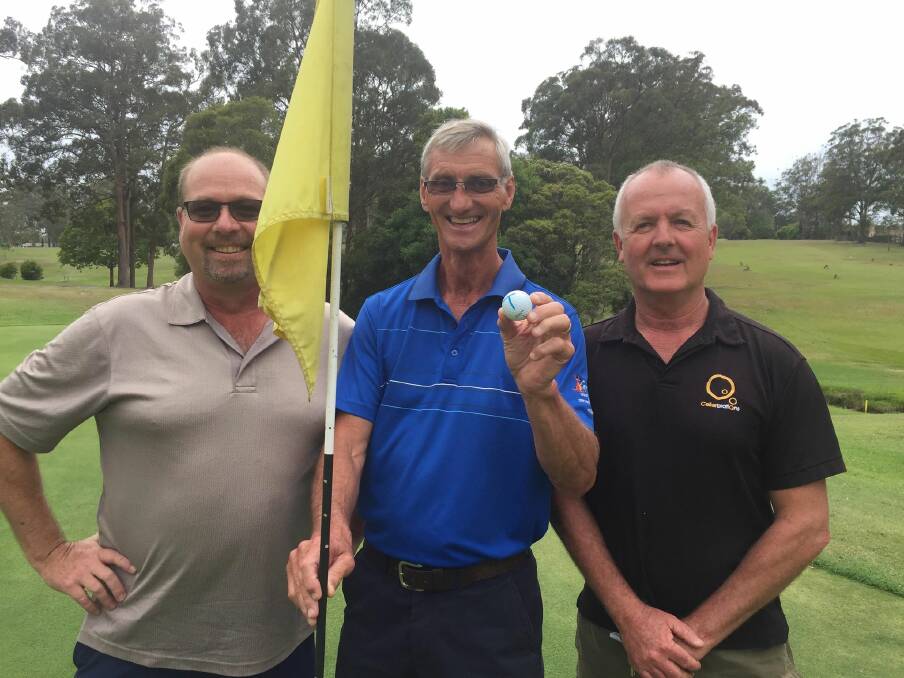 Kempsey Golf Club pro Mike Richards, Todd Watts, who proudly holds up his hole-in-one ball, and Kempsey Cellarbrations owner Simon Wetzler, who paid the $1450 jackpot to Todd.