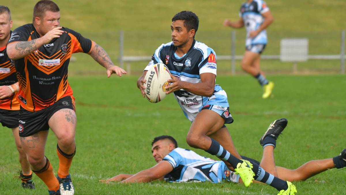 Owen Blair carries the ball forward for the Port City Breakers in their match against the Wingham Tigers on the weekend.