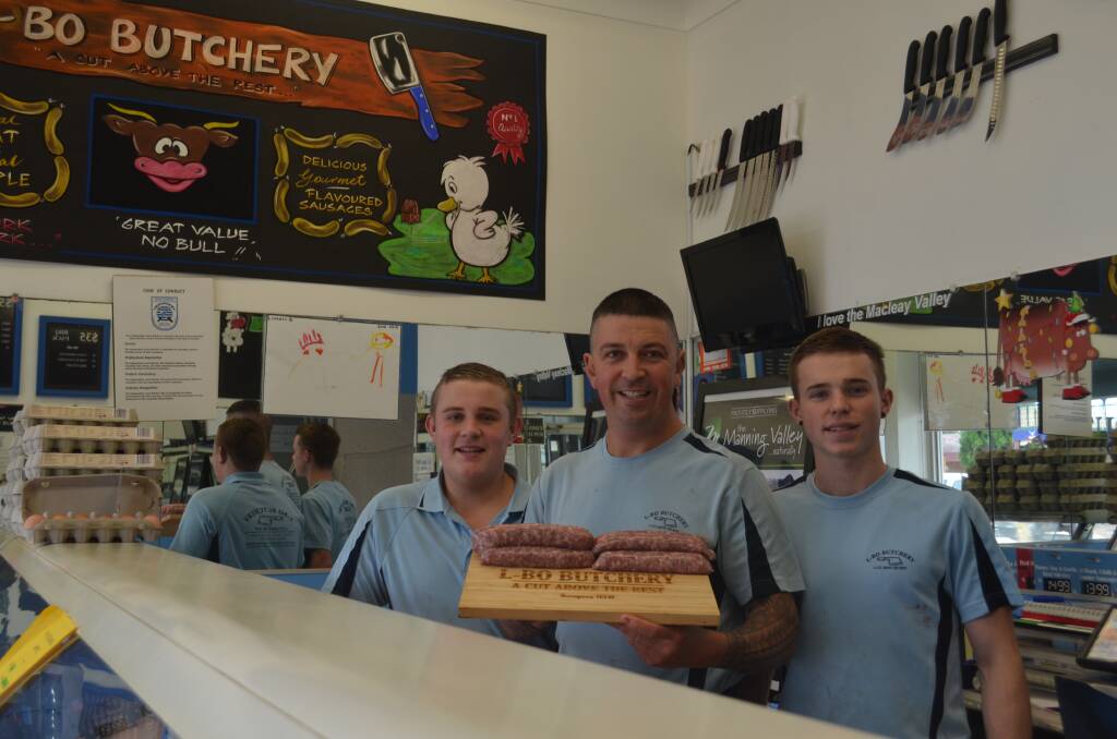Award winning sausage: Josh Ball (middle) proudly shows off his italian sausage with workmates Sam Thompson and Charlie Supple. Photo: Callum McGregor.