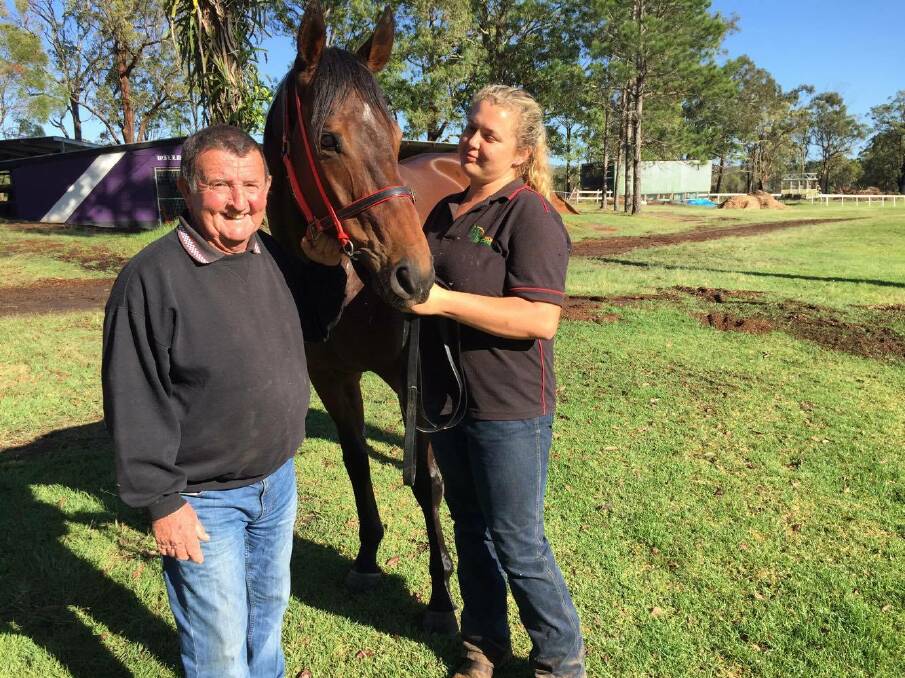 Kempsey local horse trainer Barry Ratcliffe with strapper Ashleigh Noonan and Malleable.