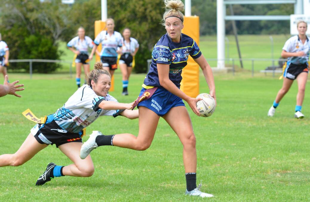 Hands free: Mustangs' Chloe Saunders looks for an offload in a match earlier this season. Photo: Penny Tamblyn.