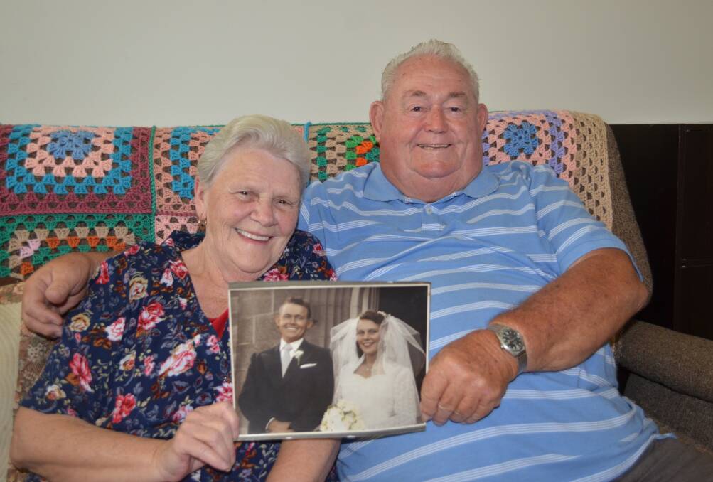 Sixty of the best: George and Gwen Holden hold a picture of their special wedding day. Photo: Callum McGregor.
