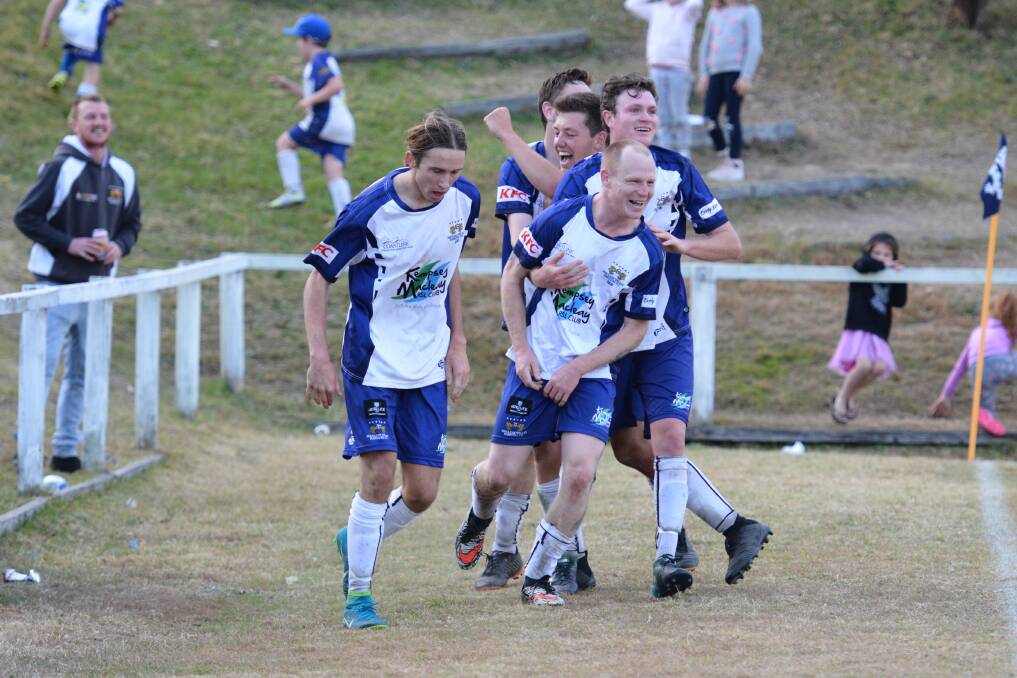 Rangers celebrate Andrew Potter scoring the side's fourth goal in their major semi-final with Port United on Saturday.
