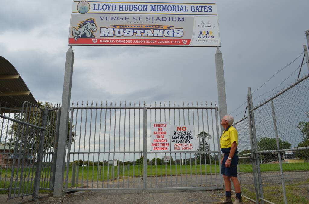 Honour: Mike Spalding, who was the inaugural Macleay Valley Mustangs president, looks up at the Lloyd Hudson Memorial Gates. Photo: Callum McGregor.