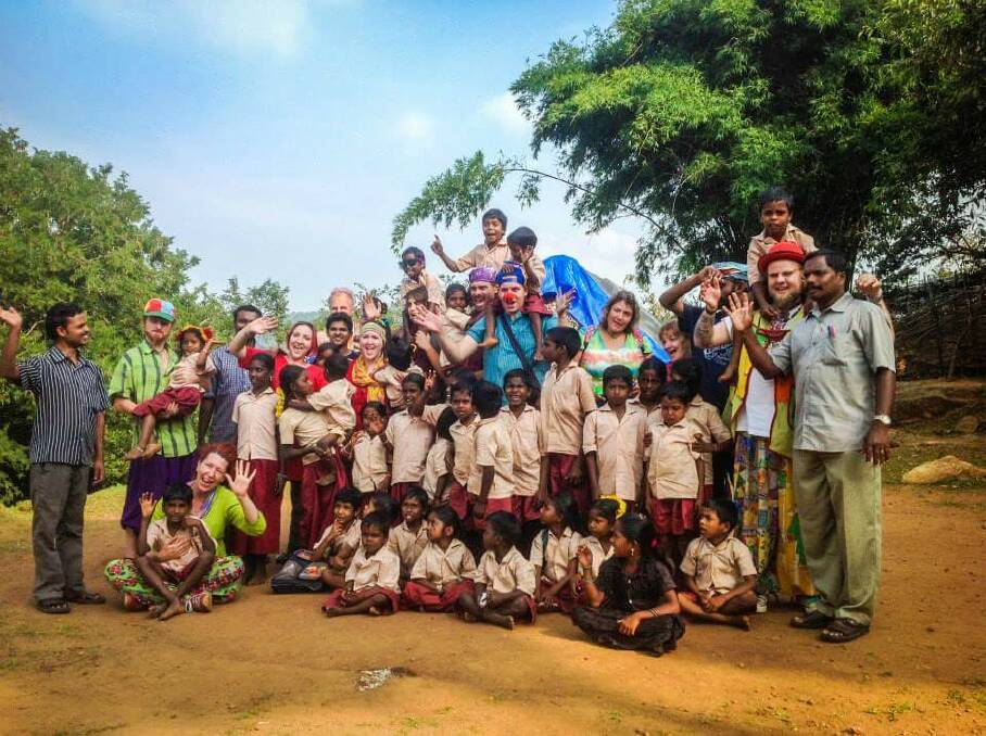 Tim Webster and other Humanitarian Clowns with children in India.