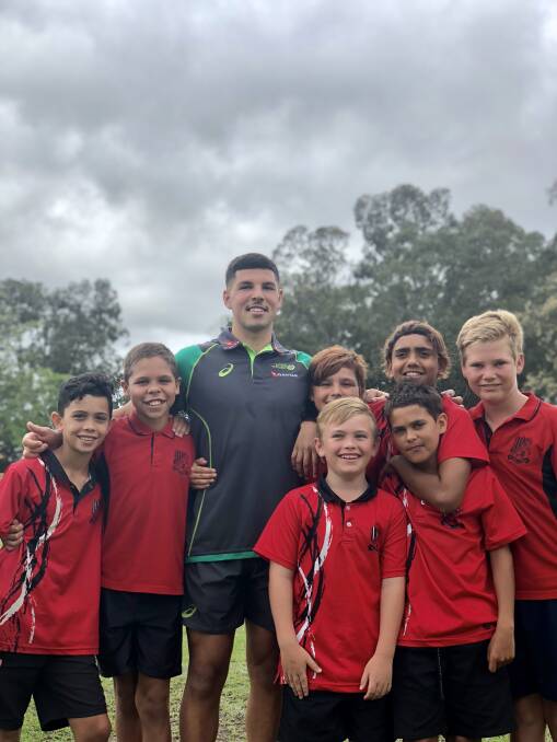Australian Rugby Sevens player Triston Reilly with South Kempsey Public School students.