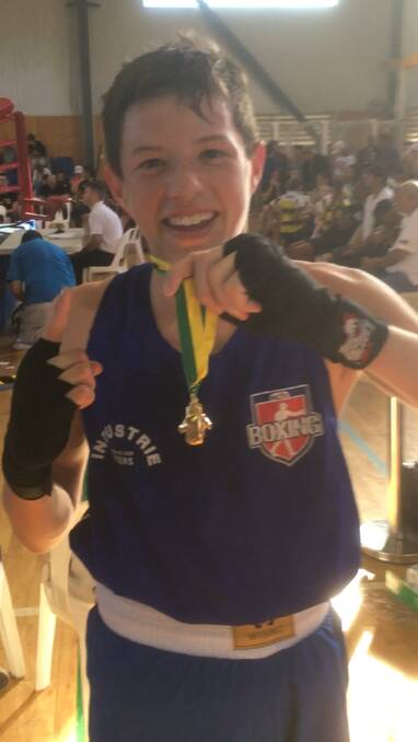 Champion: Levi Langham after claiming the Australian Schoolboys Golden Gloves Champion in Under 15 years 52kg Division title in Brisbane last week. Photo: Supplied.