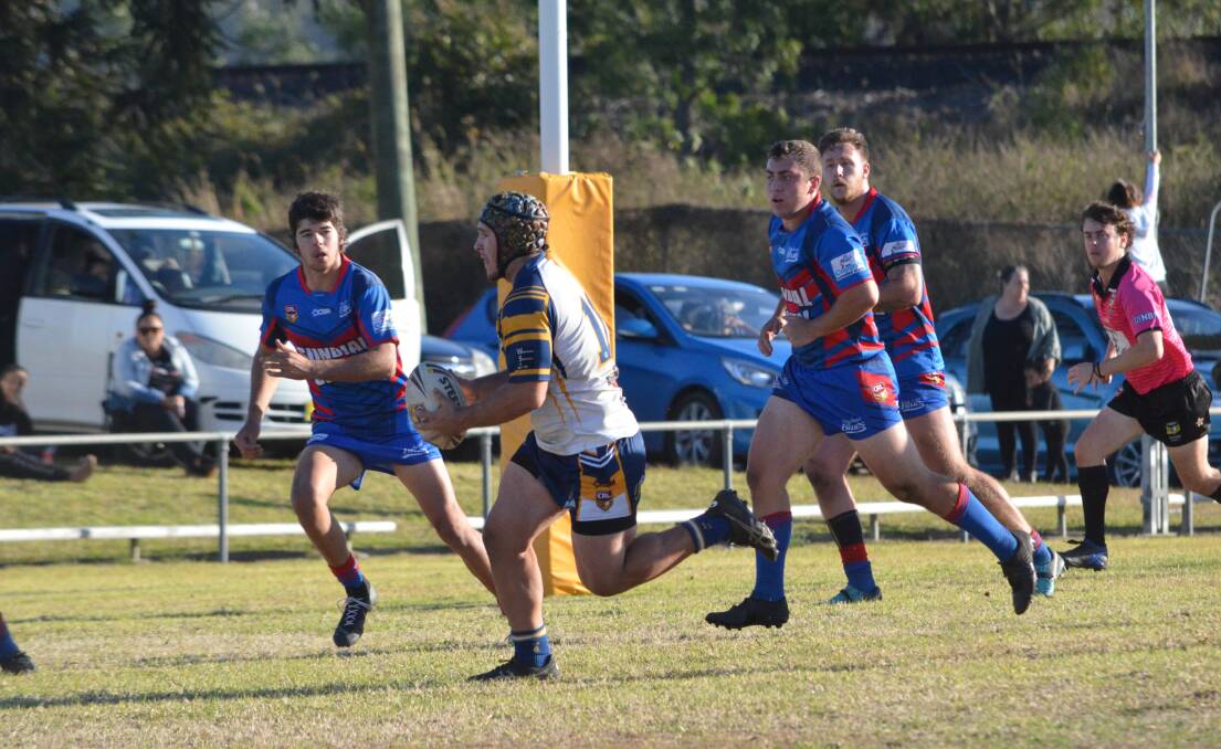 Mustangs backrower Jesse Douglas carries the ball forward close to the Wauchope line. Photo: Callum McGregor