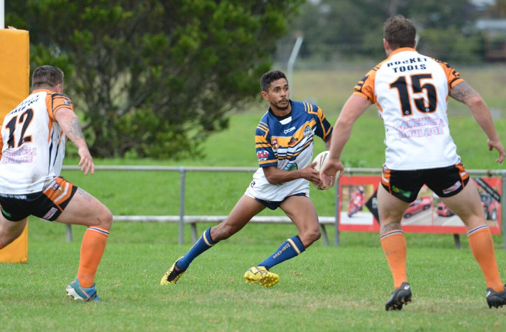 Taking on the defence: Macleay Valley Mustangs fullback Owen Blair returns a kick against the Wingham Tigers. Photo: Penny Tamblyn