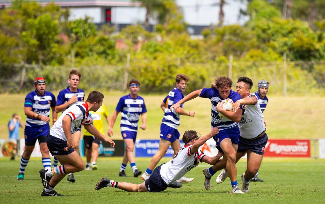 Hard yards: Kempsey's Kaine Parkinson shrugs off would-be defenders as he fights his way forward. Photo: Country Rugby League.