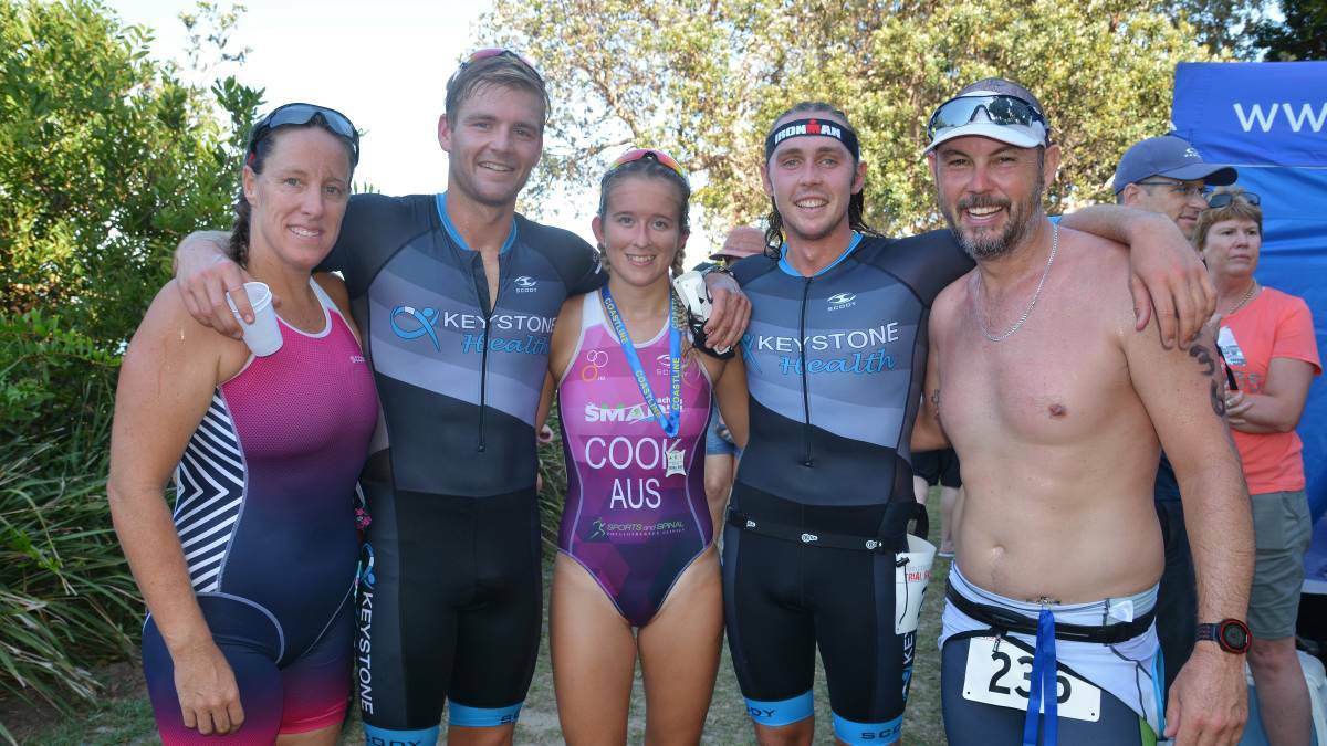 Finished: Competitors from last year's Trial Bay Triathlon take a well-earned celebratory photo after successfully finishing the course. Photo: Penny Tamblyn.
