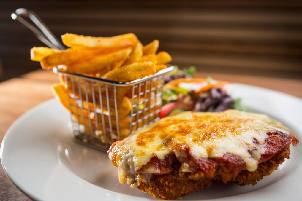 GOOD EATING: Beers and parmas are back on the menu in NSW from Friday, but there's a catch. Photo: CHRIS HOPKINS