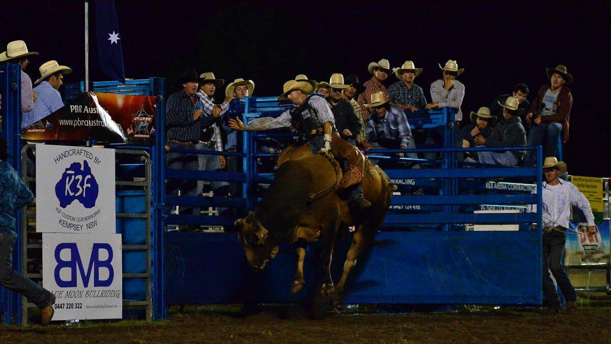 Hold on tight: Aldavilla professional bullrider Jared Farley finished third in Saturday's charity event at Kempsey Showground. He went into the final as the top scoring qualifier out of 40.
