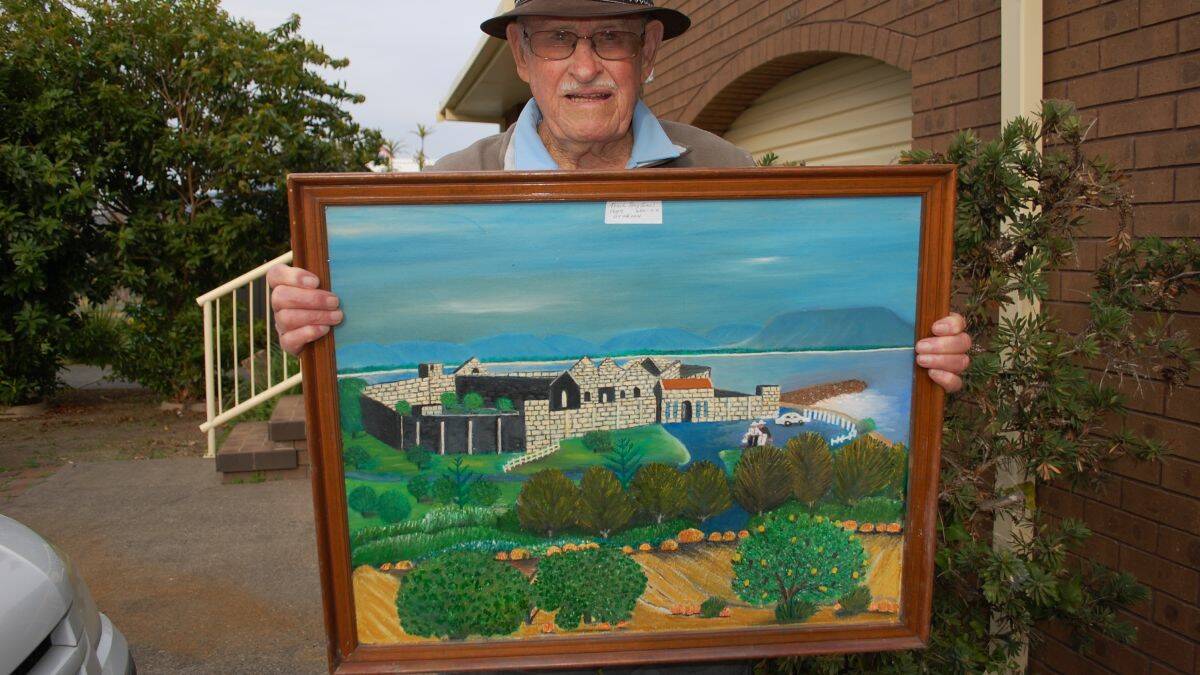 Unique perspective: Tom Tyne with his beloved Trial Bay Gaol picture, painted in 1947 before the pines altered the vista