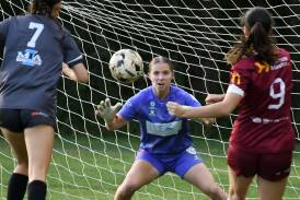 Mid Coast goalie Grace Davies makes a save during the clash against Warners Bay in a clash at the Taree Zone Field earlier this season. Mid Coast won the match 2-0.