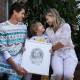 Cameron and Michelle Turner with son Arlo, 8, hold a commemorative sketch of daughter Flo who passed away from a deadly brain cancer in April. Picture by Simone De Peak 