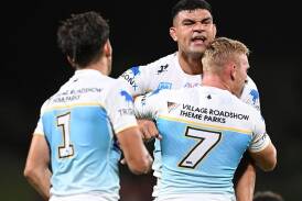 Tanah Boyd (7) was as surprised as anyone when David Fifita (C) decided to turn down the Roosters. (Darren England/AAP PHOTOS)